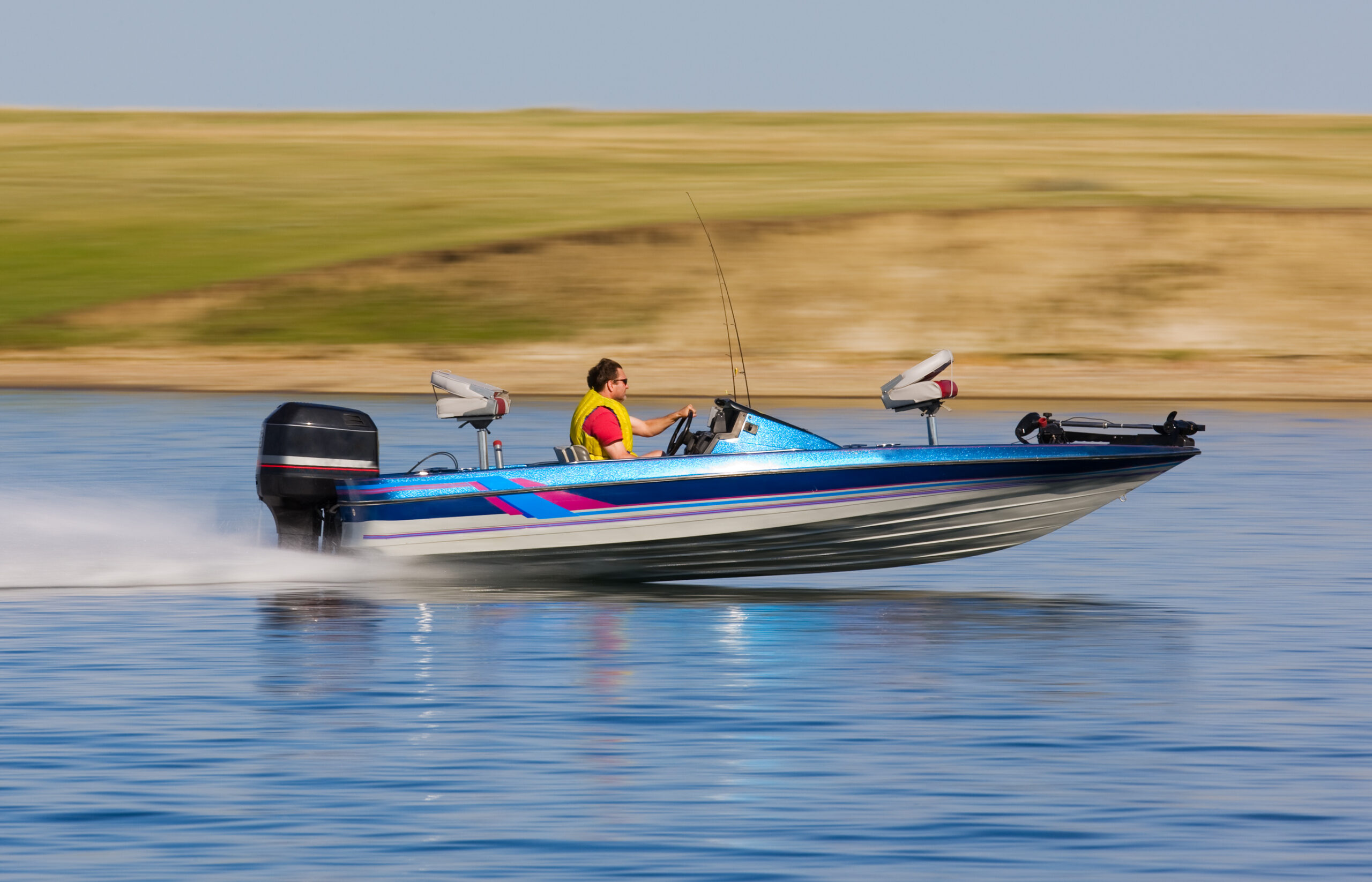 A fisherman jetting along a Tennessee lake in his new power boat after getting approved for a boat loan.