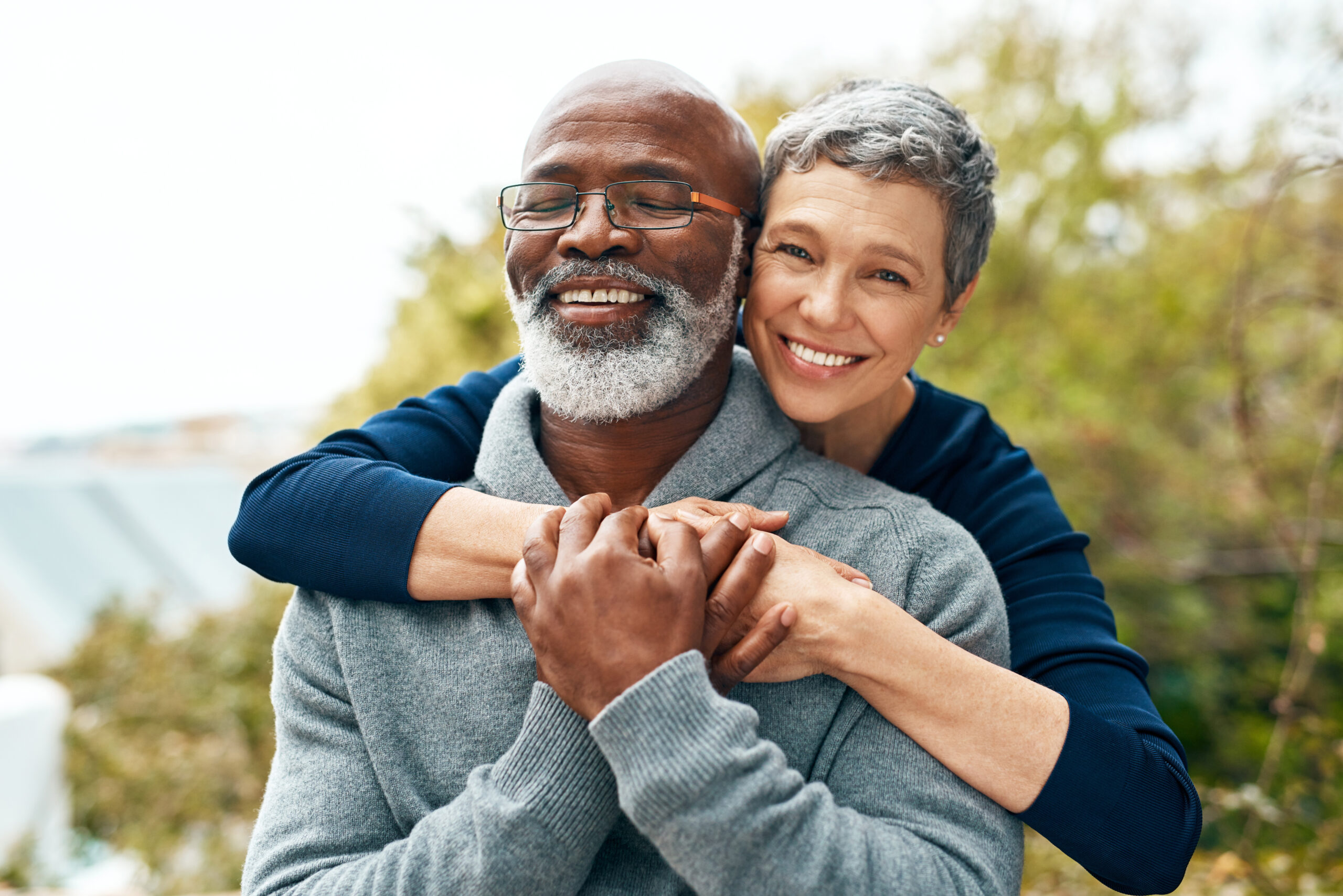 A happy couple embrace